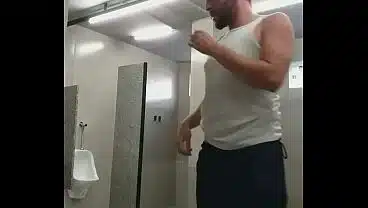 I almost got caught exposing myself in the gym bathroom, and the guys almost caught me.